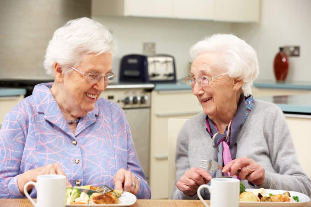 Senior women enjoying meal together